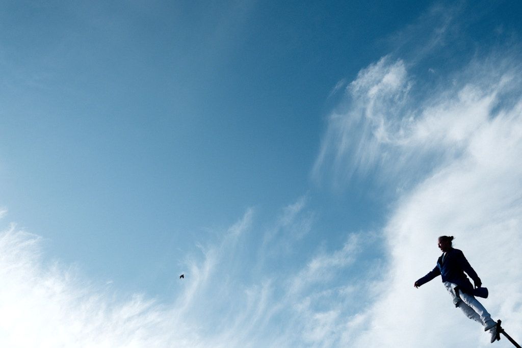 Man and bird. Street circus.